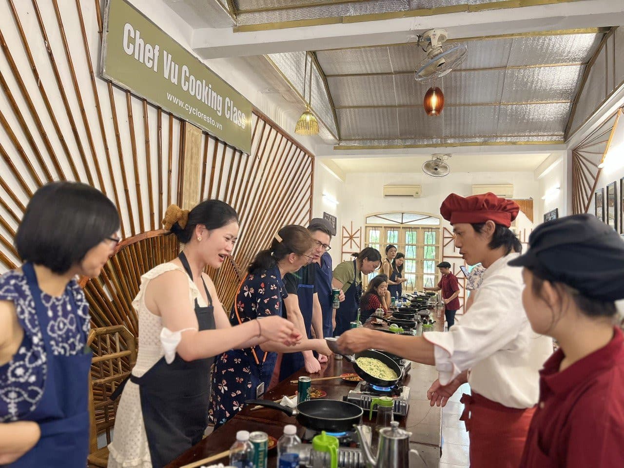 Chef Vu Cooking Class with Market Tour and Cyclo Ride - image 3